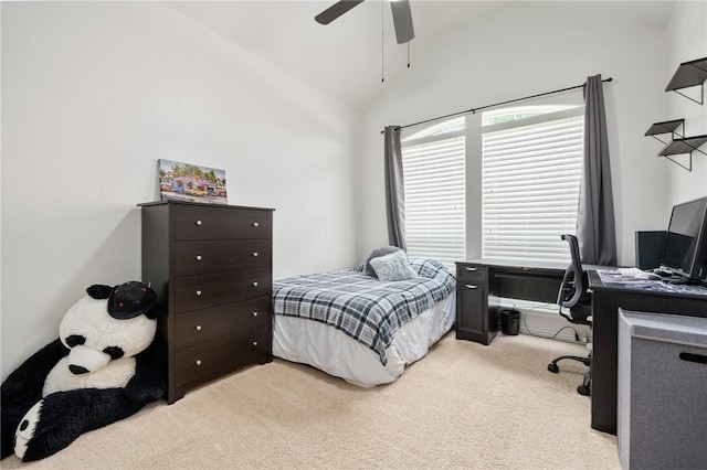 carpeted bedroom with vaulted ceiling and ceiling fan