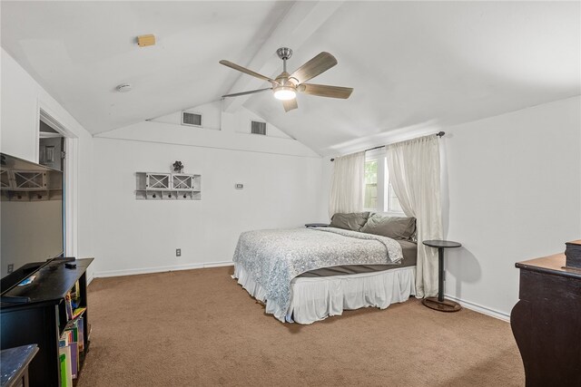 bedroom featuring lofted ceiling with beams, carpet, and ceiling fan