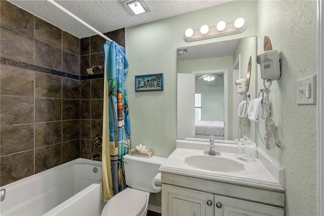 full bathroom featuring vanity, toilet, shower / tub combo, and a textured ceiling