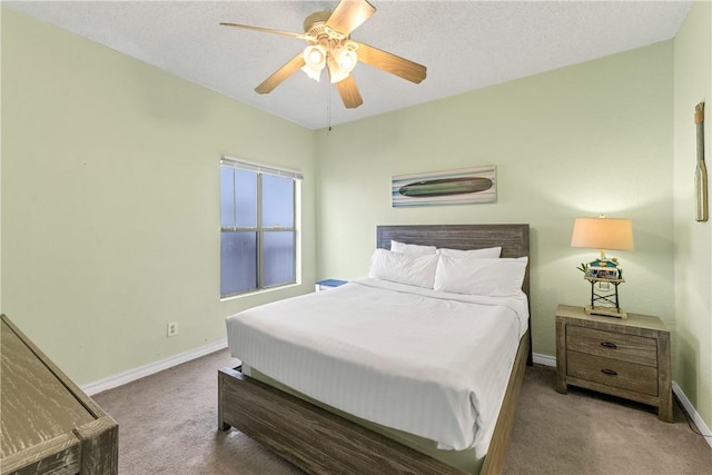 bedroom featuring ceiling fan and carpet