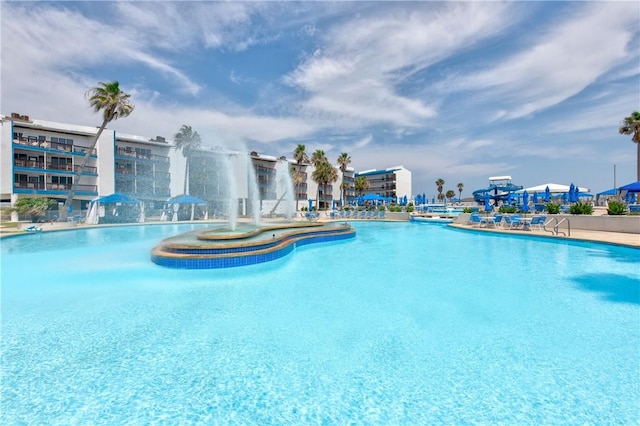 view of swimming pool featuring pool water feature