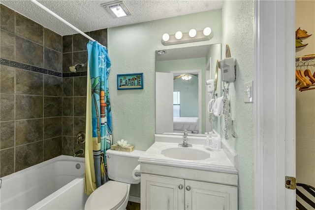 full bathroom with shower / tub combo with curtain, vanity, toilet, and a textured ceiling