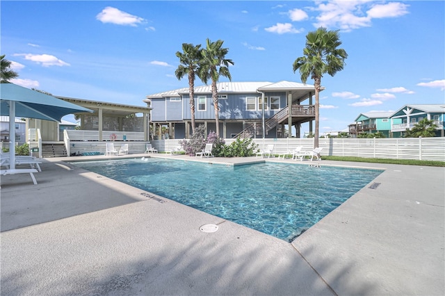 view of swimming pool with a patio