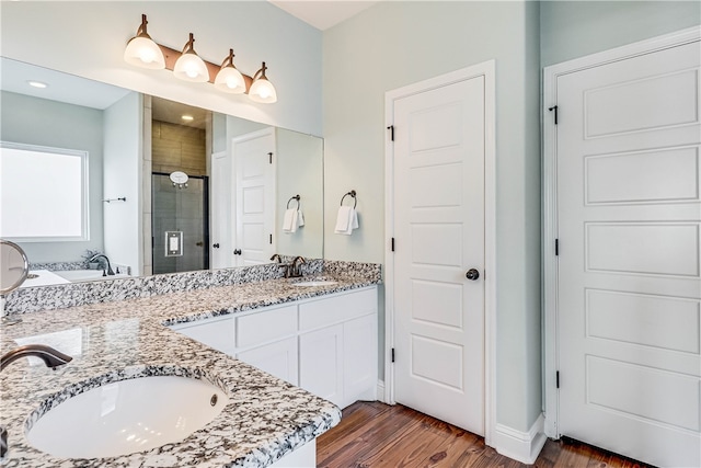 bathroom featuring hardwood / wood-style floors, vanity, and shower with separate bathtub