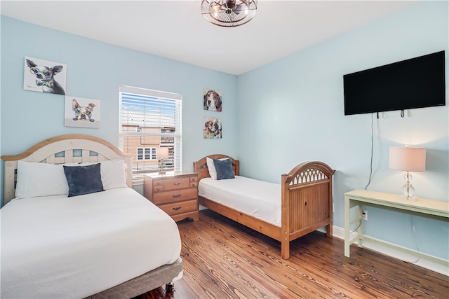 bedroom with hardwood / wood-style floors