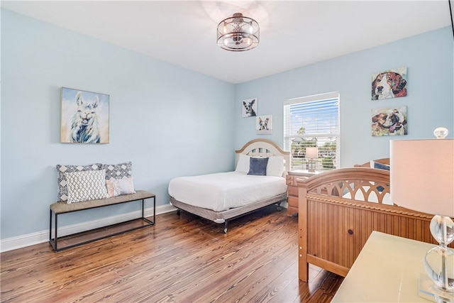 bedroom featuring wood-type flooring