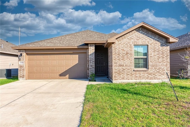 view of front facade with a garage, central AC unit, and a front yard