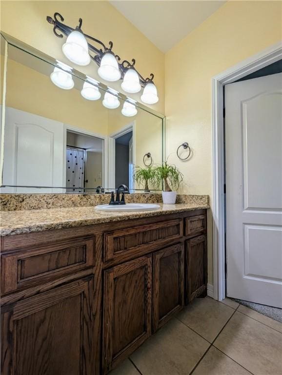 bathroom featuring tile patterned flooring and vanity