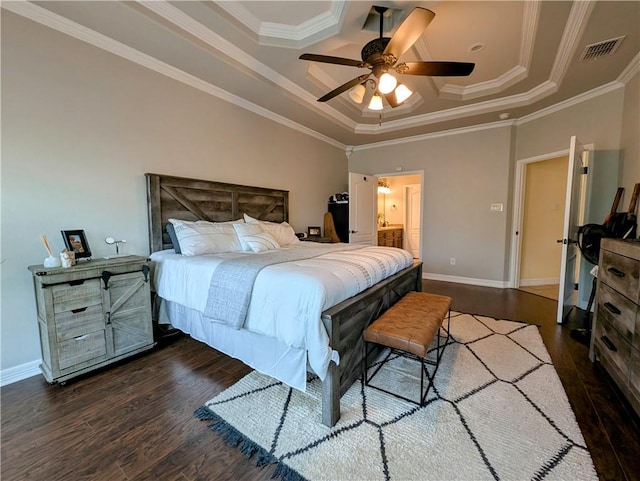 bedroom with ornamental molding, dark wood-type flooring, visible vents, and baseboards