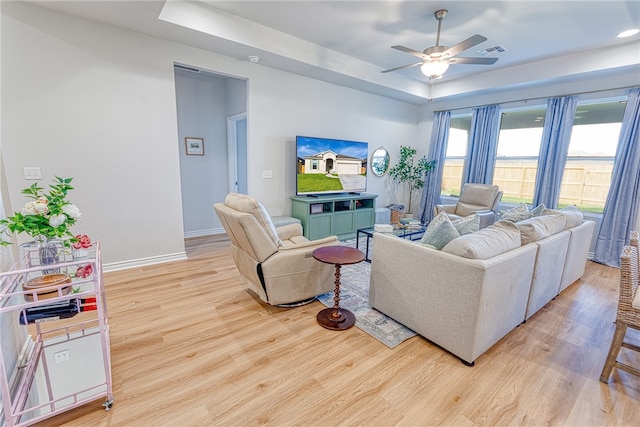 2634 Westeros St, Corpus Christi, TX 78415 - living area with a raised ceiling, light wood-style flooring, and a ceiling fan