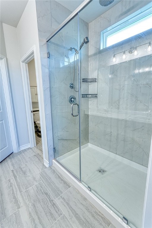 2634 Westeros St, Corpus Christi, TX 78415 - bathroom with a marble finish shower and baseboards