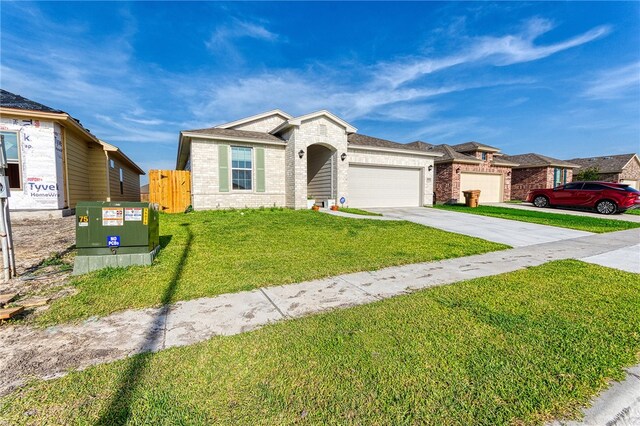 2634 Westeros St, Corpus Christi, TX 78415 - view of front facade with brick siding, a garage, and driveway