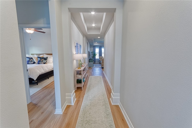 2634 Westeros St, Corpus Christi, TX 78415 - hallway featuring light wood-style flooring, a raised ceiling, and recessed lighting