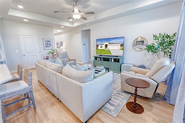 2634 Westeros St, Corpus Christi, TX 78415 - living room featuring light wood-style flooring, recessed lighting, ceiling fan, and a raised ceiling