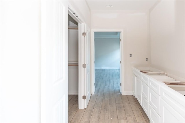 112 Shoalwater Way, Rockport, TX 78382 - bathroom with wood finished floors and baseboards