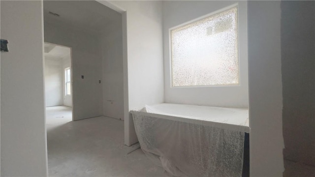 hallway with concrete floors