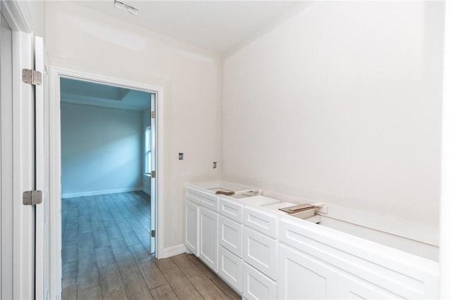 112 Shoalwater Way, Rockport, TX 78382 - bathroom with wood finished floors and baseboards
