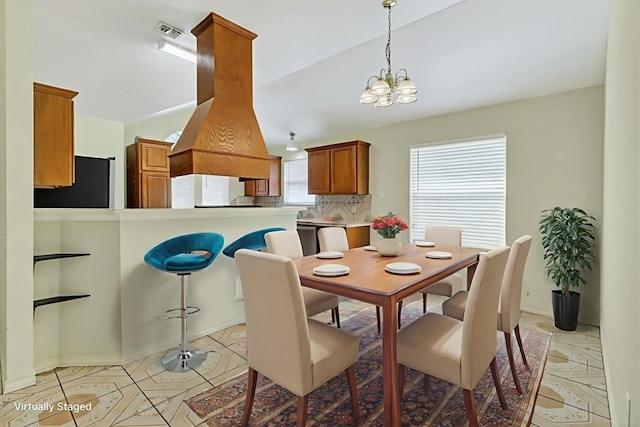 1225 Calle, San Carlos, Corpus Christi, TX 78417 - dining room with a chandelier, light tile patterned flooring, and lofted ceiling