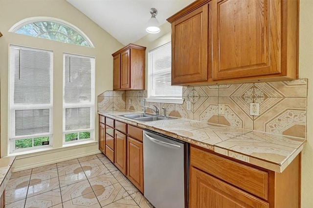 1225 Calle, San Carlos, Corpus Christi, TX 78417 - kitchen featuring dishwasher, backsplash, lofted ceiling, plenty of natural light, and light tile patterned floors