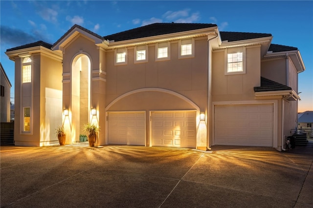 view of front of property with a garage