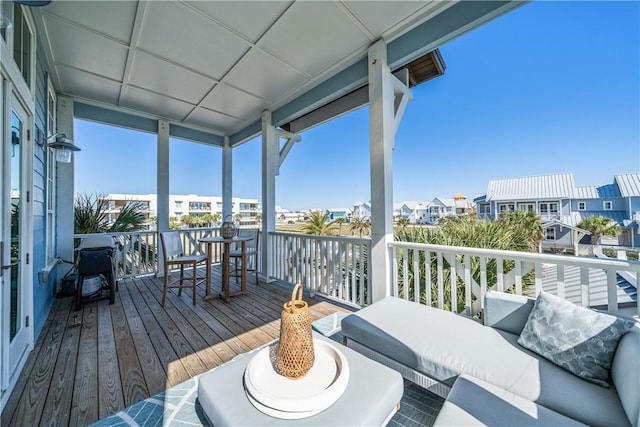 wooden deck featuring a residential view and an outdoor hangout area