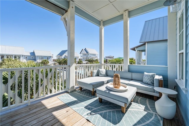 deck with an outdoor living space and a residential view