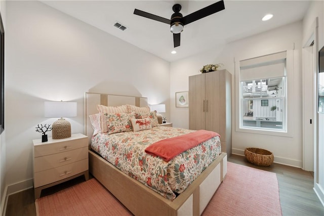 bedroom with light wood finished floors, baseboards, visible vents, and recessed lighting