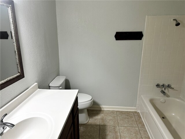 full bathroom featuring vanity, tile patterned floors, toilet, and shower / bath combination