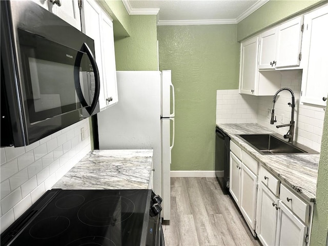 1011 Ennis Joslin Unit 235, Corpus Christi, TX 78412 - kitchen featuring black appliances, a sink, a textured wall, ornamental molding, and backsplash