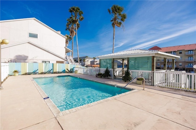 view of swimming pool with a patio area