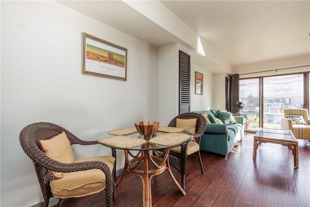 dining room with dark hardwood / wood-style flooring