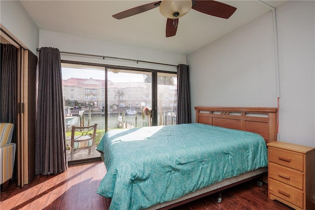 bedroom featuring ceiling fan and dark hardwood / wood-style floors