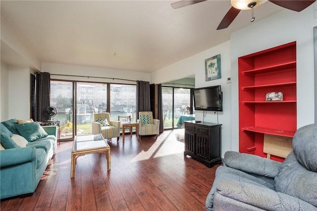 living room with ceiling fan and hardwood / wood-style flooring