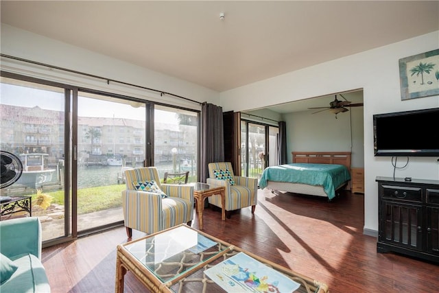 bedroom featuring access to outside, ceiling fan, and hardwood / wood-style floors