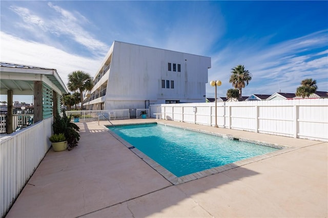 view of swimming pool featuring a patio