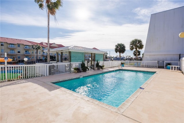 view of swimming pool with a patio area