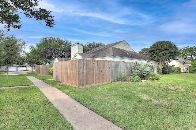 view of property exterior featuring a lawn