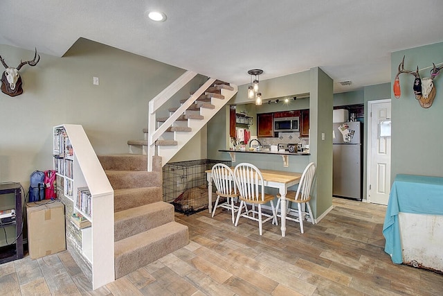 dining area featuring light hardwood / wood-style floors