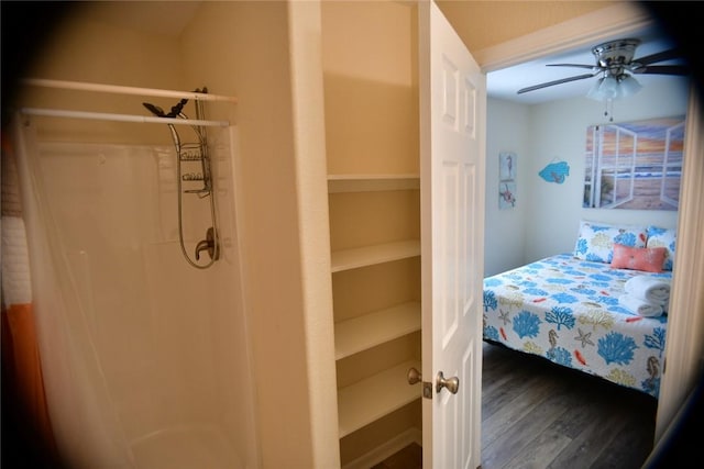 bedroom featuring ceiling fan and dark wood finished floors