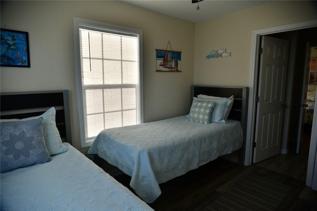 bedroom with dark wood finished floors