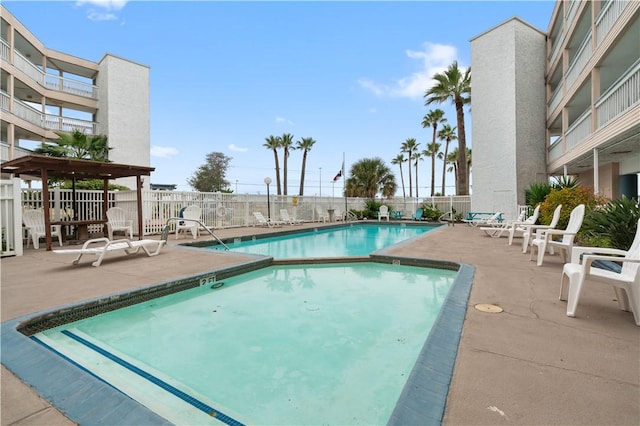 view of swimming pool featuring a patio area