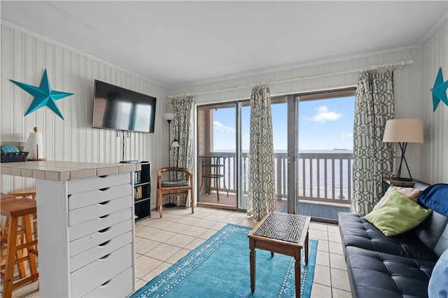 living room featuring ornamental molding and light tile patterned flooring