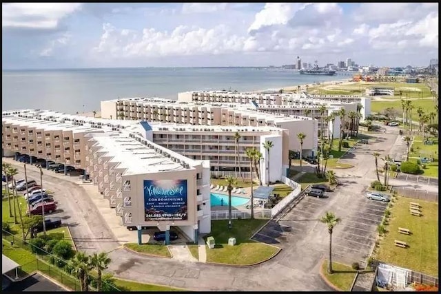 birds eye view of property with a water view