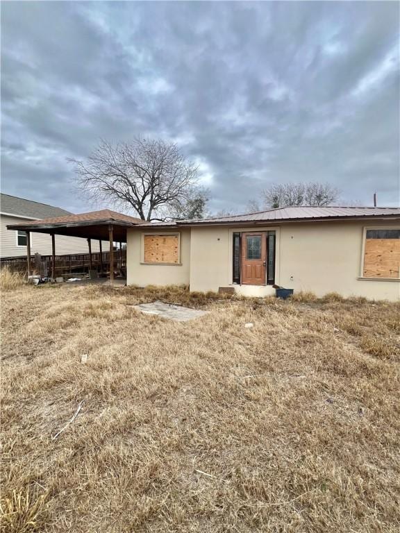 rear view of house with a yard