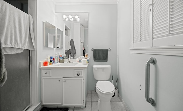 bathroom featuring tile patterned flooring, vanity, toilet, and walk in shower