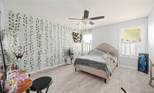 bedroom featuring ceiling fan and light hardwood / wood-style floors