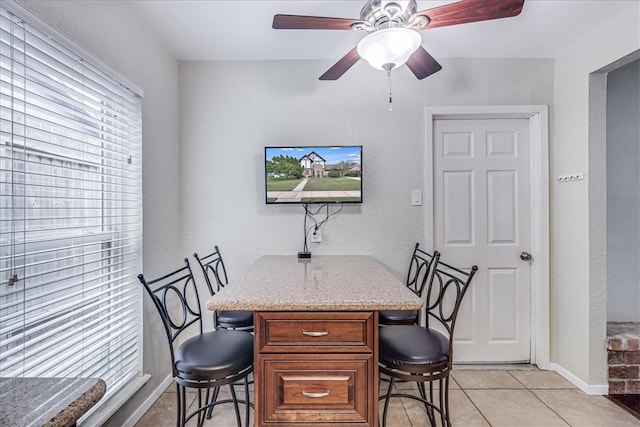 tiled office with ceiling fan