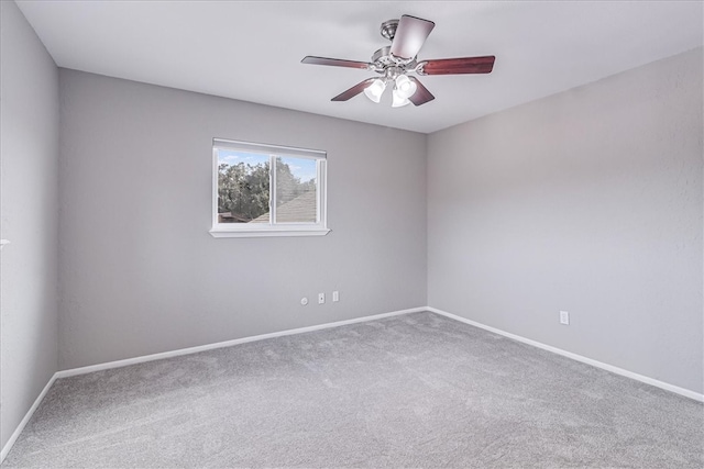 spare room with carpet flooring and ceiling fan