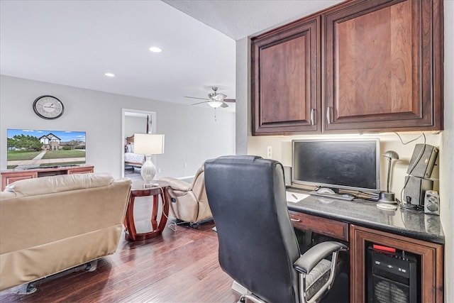 office with hardwood / wood-style flooring and ceiling fan