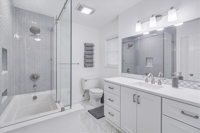 full bathroom with vanity, enclosed tub / shower combo, and toilet